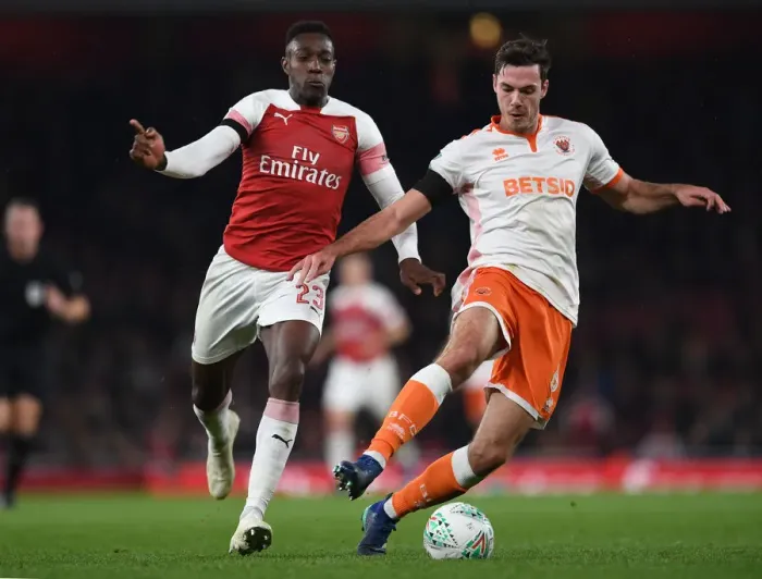 Framed Print : Arsenal's Danny Welbeck Closes In on Blackpool's Ben Heneghan in Carabao Cup Showdown