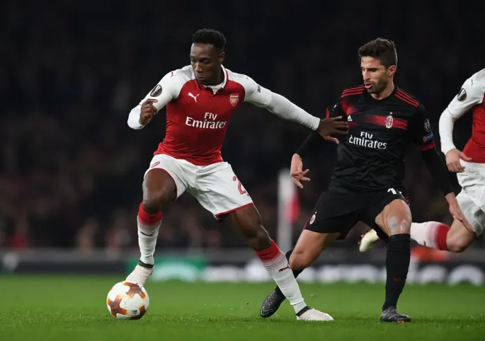 Framed Print : Arsenal's Danny Welbeck Faces Off Against AC Milan's Fabio Borini in Europa League Clash Framed Print : Arsenal's Danny Welbeck Faces Off Against AC Milan's Fabio Borini in Europa League Clash