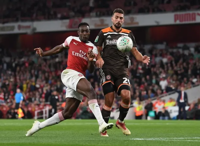 Framed Print : Arsenal's Danny Welbeck Faces Off Against Brentford's Ezri Konsa in Carabao Cup Clash Framed Print : Arsenal's Danny Welbeck Faces Off Against Brentford's Ezri Konsa in Carabao Cup Clash