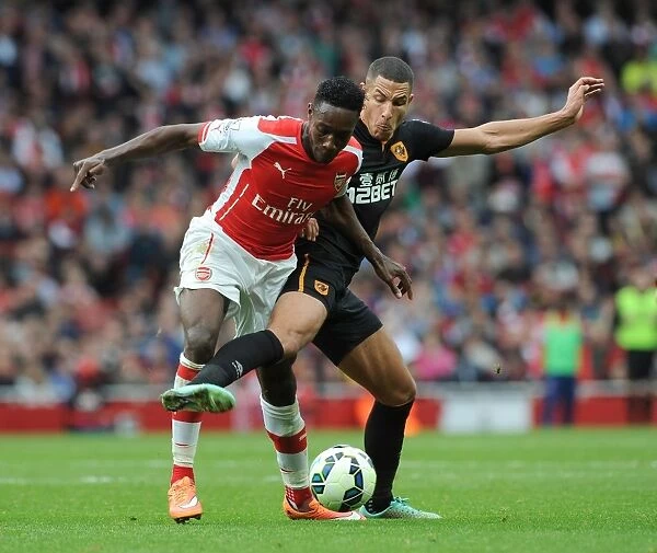 Arsenal's Danny Welbeck Faces Off Against Hull's Jake Livermore in Intense Premier League Clash