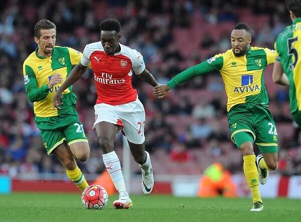 Arsenal's Danny Welbeck Faces Off Against Norwich's Gary O'Neil and Nathan Redmond during the 2015-16 Premier League Match