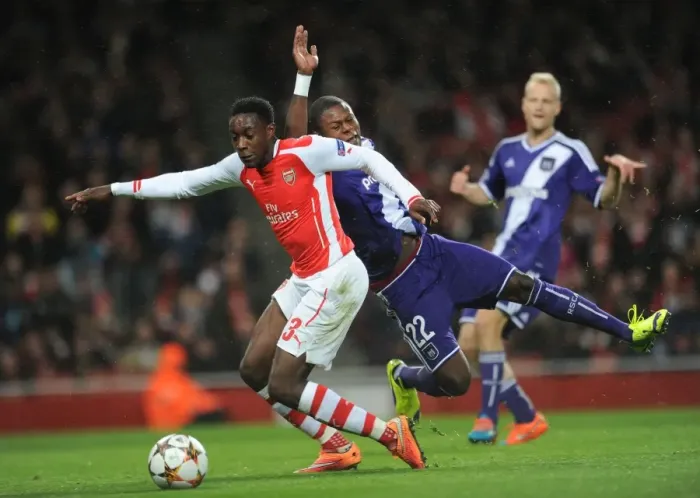 Framed Print : Arsenal's Danny Welbeck Fouled by Chancel Mbemba, Awarding a Penalty in UEFA Champions League Match against Anderlecht Framed Print : Arsenal's Danny Welbeck Fouled by Chancel Mbemba, Awarding a Penalty in UEFA Champions League Match against Anderlecht