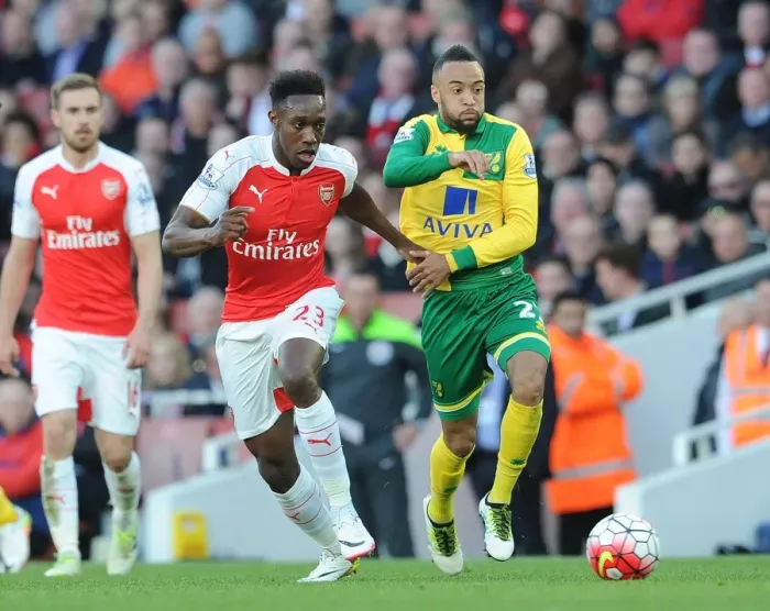 Framed Print : Arsenal's Danny Welbeck vs. Nathan Redmond: Intense Clash in Arsenal v Norwich City Premier League Match