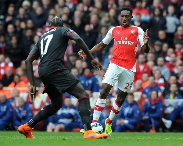 Arsenal's Danny Welbeck vs. Liverpool's Mamadou Sakho: Intense Clash in Premier League Showdown