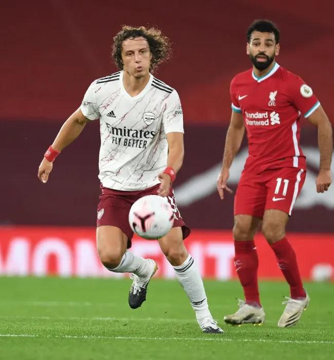 Framed Print : Arsenal's David Luiz at Anfield: Premier League Clash Amidst Empty Stands (Liverpool v Arsenal 2020-21) Framed Print : Arsenal's David Luiz at Anfield: Premier League Clash Amidst Empty Stands (Liverpool v Arsenal 2020-21)
