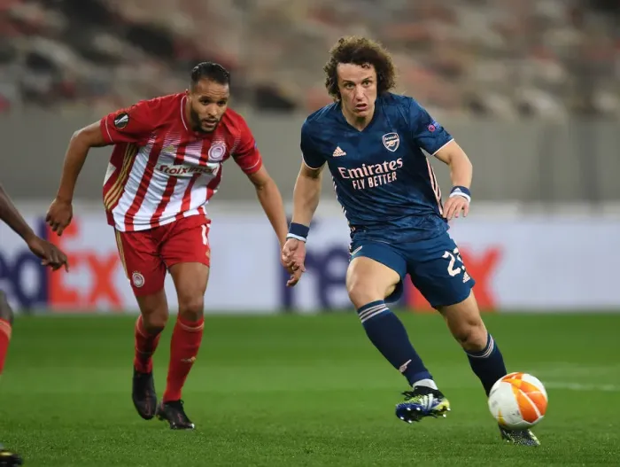 Framed Print : Arsenal's David Luiz Faces Olympiacos in Empty Europa League Stadium