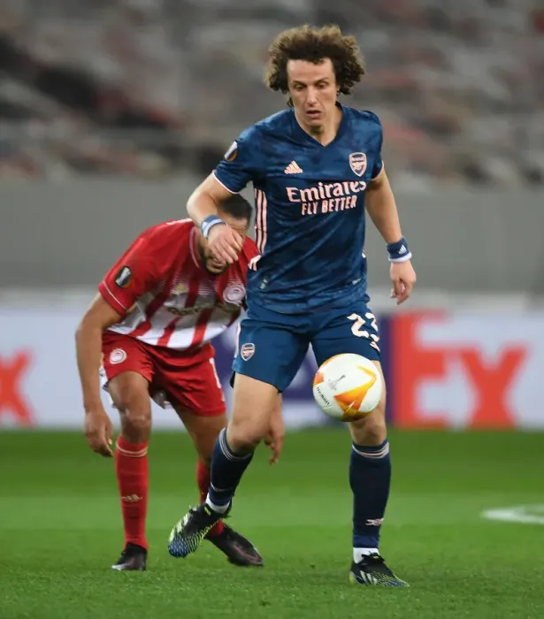 Framed Print : Arsenal's David Luiz Fights On: Empty Europa League Stadium Battle Against Olympiacos Framed Print : Arsenal's David Luiz Fights On: Empty Europa League Stadium Battle Against Olympiacos