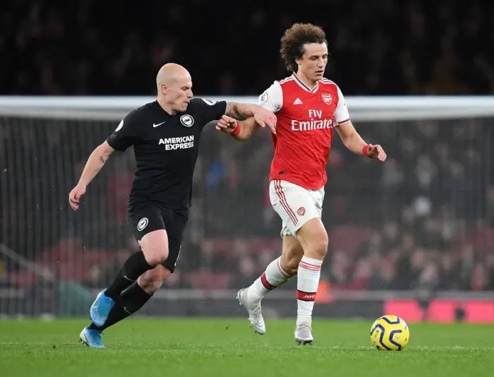 Framed Print : Arsenal's David Luiz Outmaneuvers Brighton's Aaron Mooy in Premier League Clash Framed Print : Arsenal's David Luiz Outmaneuvers Brighton's Aaron Mooy in Premier League Clash