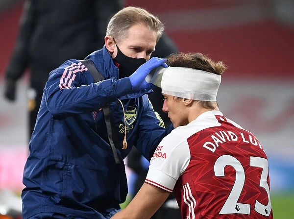Arsenal's David Luiz Receives Head Injury Treatment Alone at Empty Emirates Stadium (Premier League 2020-21: Arsenal vs. Wolverhampton Wanderers)