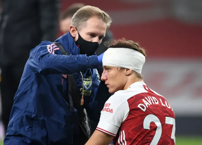Framed Print : Arsenal's David Luiz Receives Solo Head Injury Treatment in Empty Emirates Stadium (Premier League, 2020-21)