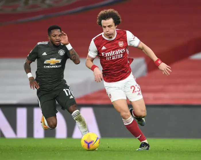 Framed Print : Arsenal's David Luiz Slips Past Manchester United's Fred: Empty Emirates Showdown, Premier League 2021 Framed Print : Arsenal's David Luiz Slips Past Manchester United's Fred: Empty Emirates Showdown, Premier League 2021