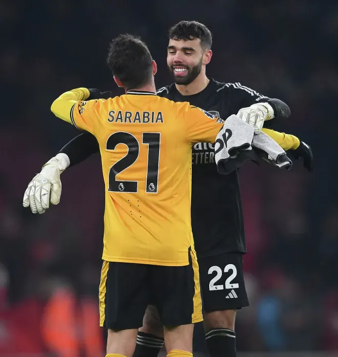 Framed Print : Arsenal's David Raya Embraces Pablo Sarabia After Intense Arsenal v Wolverhampton Wanderers Clash (2023-24)