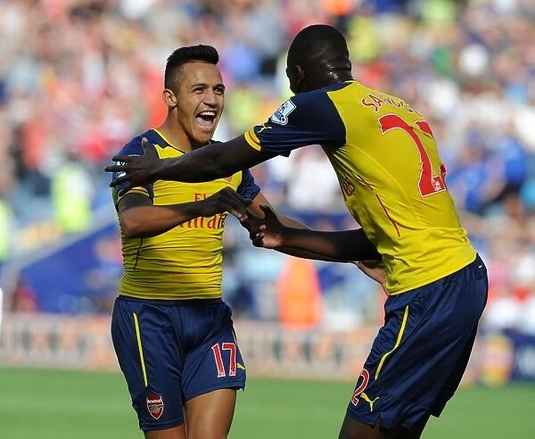 Arsenal's Deadly Duo: Sanchez and Sanogo Celebrate Goal Against Leicester City (2014-15)