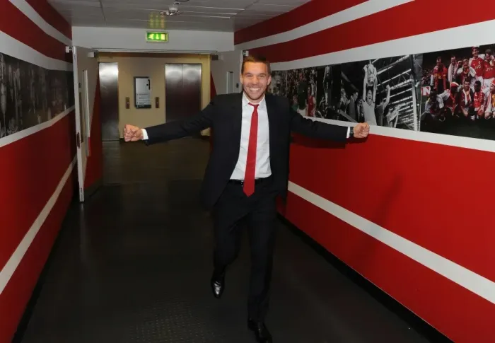 Framed Print : Arsenal's Deadly Weapon: Lukas Podolski Gears Up for Battle Against West Bromwich Albion (2013-14)