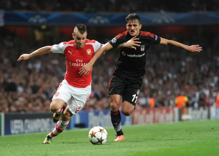 Framed Print : Arsenal's Debuchy Clashes with Besiktas Pektemek in Champions League Showdown Framed Print : Arsenal's Debuchy Clashes with Besiktas Pektemek in Champions League Showdown