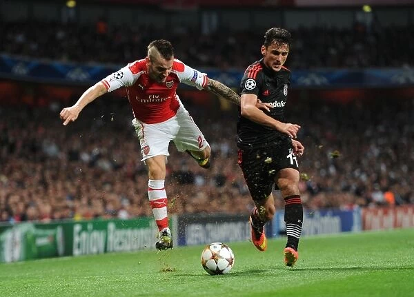 Arsenal's Debuchy Clashes with Besiktas Pektemek in UEFA Champions League Qualifier