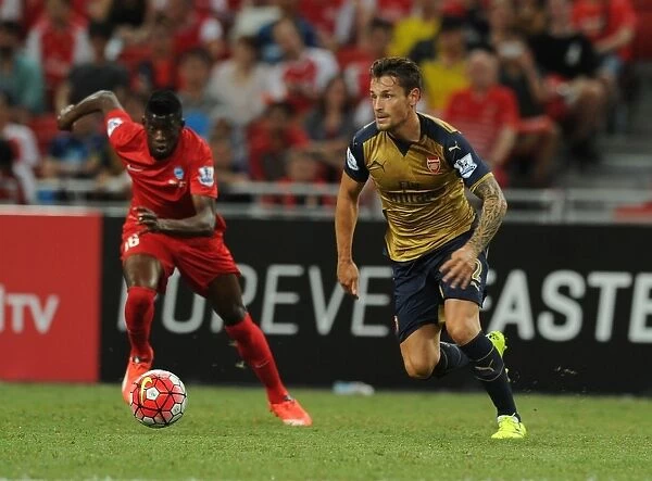 Arsenal's Debuchy Outruns Opponent at 2015 Barclays Asia Trophy