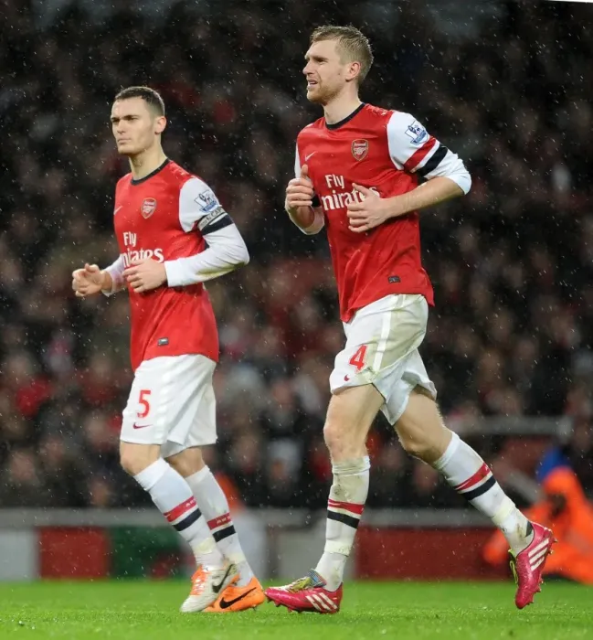 Framed Print : Arsenal's Defensive Duo: Vermaelen and Mertesacker in Action (Arsenal vs. Chelsea, 2013-14)