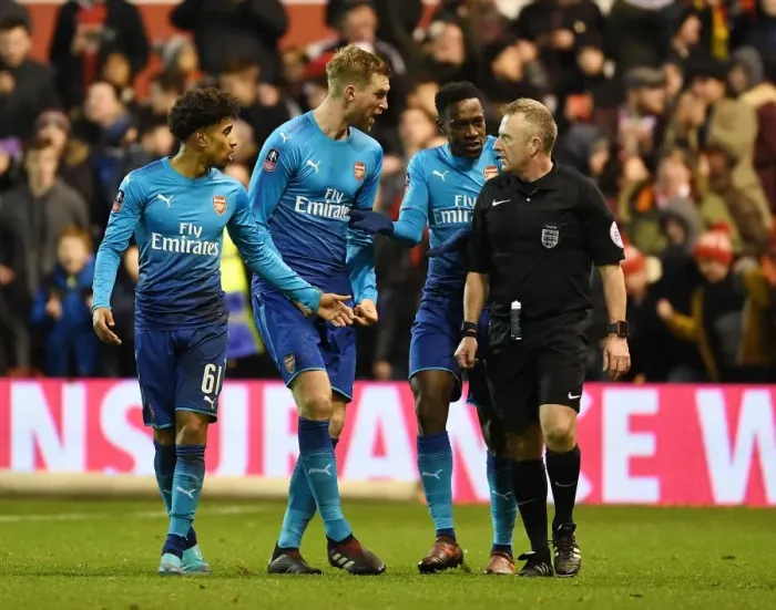 Framed Print : Arsenal's Disputed Penalties: Nelson, Welbeck, and Mertesacker Argue with Ref during Nottingham Forest FA Cup Match Framed Print : Arsenal's Disputed Penalties: Nelson, Welbeck, and Mertesacker Argue with Ref during Nottingham Forest FA Cup Match