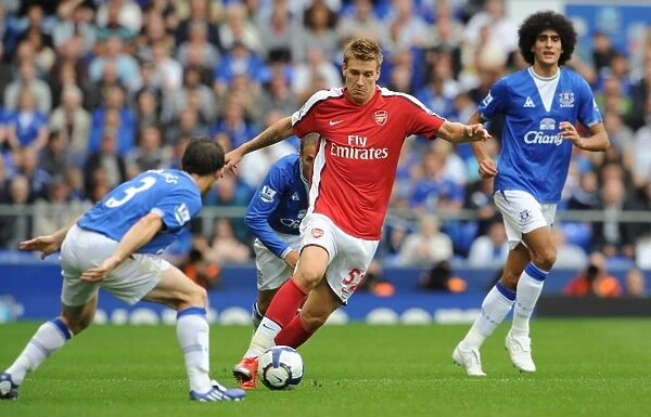 Arsenal's Dominance: Bendtner Scores Six Against Everton's Baines and Fellaini