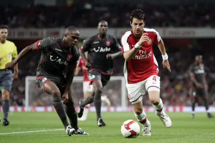 Framed Print : Arsenal's Dominance: Cesc Fabregas Scores Twice in 4-0 Win over FC Twente (UEFA Champions League) Framed Print : Arsenal's Dominance: Cesc Fabregas Scores Twice in 4-0 Win over FC Twente (UEFA Champions League)