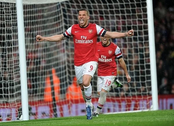 Arsenal's Dominance: Podolski's Brace Secures 4-1 Premier League Victory Over Wigan Athletic