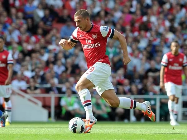 Arsenal's Dominant Victory: Lukas Podolski Scores in 6-1 Rout Against Southampton (Premier League, 2012-13)