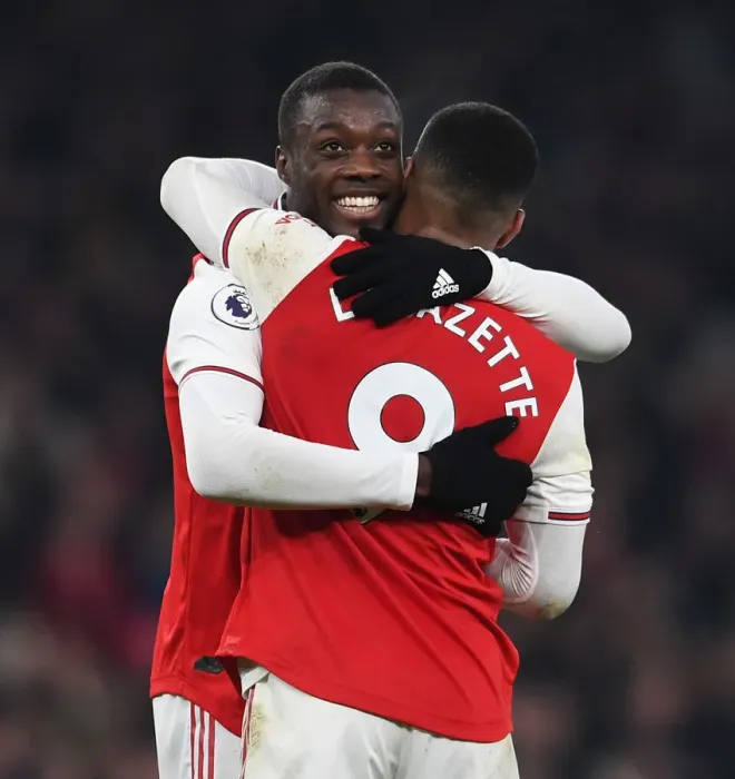 Framed Print : Arsenal's Double Act: Pepe and Lacazette Celebrate Goals Against Manchester United (2019-20) Framed Print : Arsenal's Double Act: Pepe and Lacazette Celebrate Goals Against Manchester United (2019-20)
