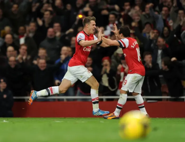Framed Print : Arsenal's Double Delight: Ramsey and Cazorla's Unforgettable Goal Celebration (2013-14)
