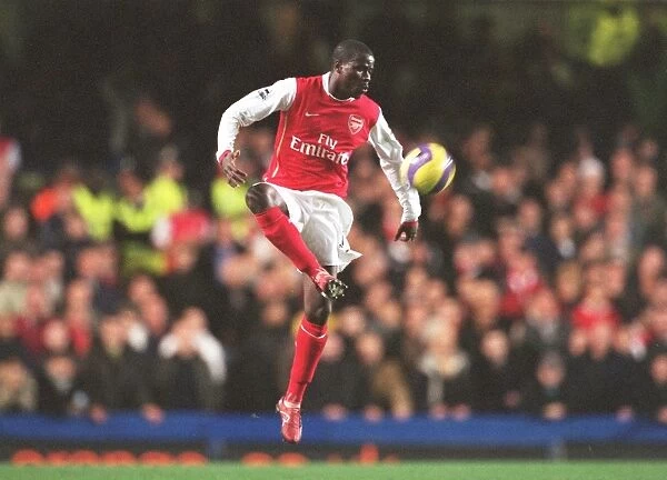 Arsenal's Eboue in Action during Chelsea Rivalry: 10 / 12 / 06 FA Premiership Draw