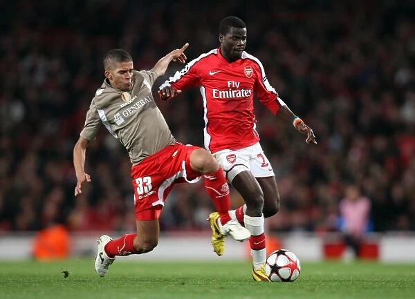 Arsenal's Eboue and Carcela-Gonzalez Shine in 2:0 UEFA Champions League Victory over Standard Liege