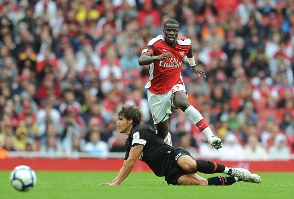 Arsenal's Eboue vs. Dominguez: A Battle at the Emirates Cup, 2009