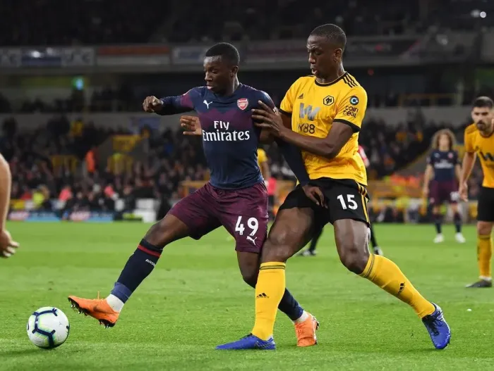 Framed Print : Arsenal's Eddie Nketiah Battles Willy Boly in Intense Wolverhampton Wanderers Clash