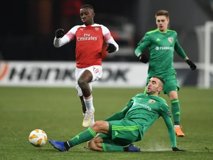 Framed Print : Arsenal's Eddie Nketiah Clashes with Ardin Dallku in Intense Europa League Encounter Framed Print : Arsenal's Eddie Nketiah Clashes with Ardin Dallku in Intense Europa League Encounter