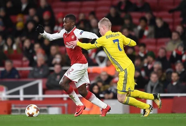 Arsenal's Eddie Nketiah Clashes with BATE Borisov's Evgeni Berezkin in Europa League Showdown