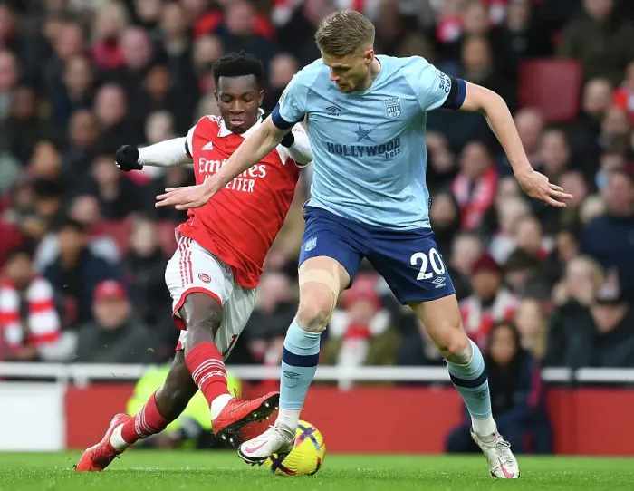 Framed Print : Arsenal's Eddie Nketiah Clashes with Brentford's Kristoffer Ajer in Premier League Showdown at Emirates Stadium