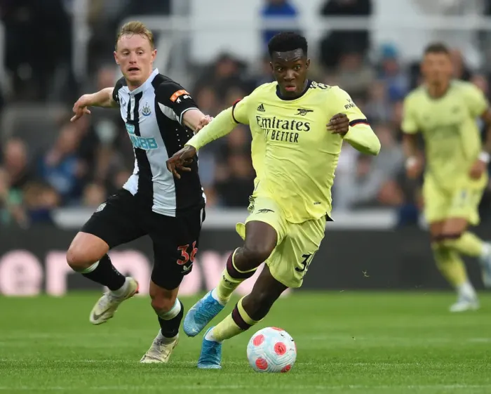 Framed Print : Arsenal's Eddie Nketiah Clashes with Newcastle's Sean Longstaff in Premier League Showdown