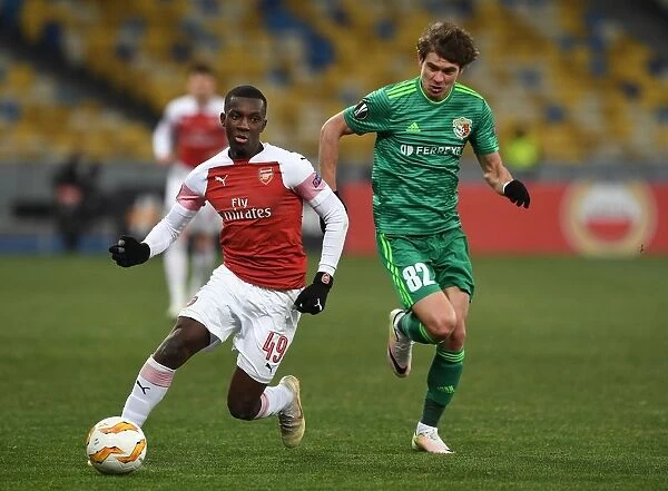 Arsenal's Eddie Nketiah Clashes with Pavlo Rebenok of Vorskla in Europa League Match