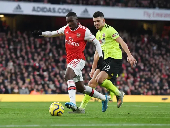 Framed Print : Arsenal's Eddie Nketiah Clashes with Sheffield United's John Egan in Premier League Showdown
