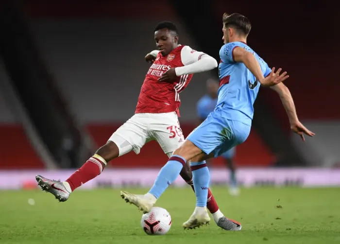Framed Print : Arsenal's Eddie Nketiah Closes In on West Ham's Aaron Creswell in Intense Arsenal v West Ham United Premier League Clash Framed Print : Arsenal's Eddie Nketiah Closes In on West Ham's Aaron Creswell in Intense Arsenal v West Ham United Premier League Clash
