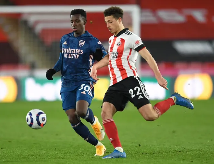 Framed Print : Arsenal's Eddie Nketiah Faces Off Against Sheffield United's Ethan Ampadu in Premier League Clash