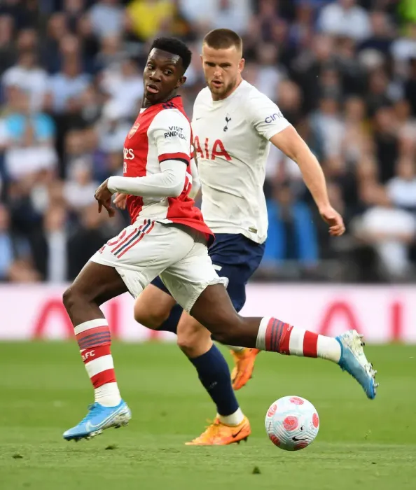 Framed Print : Arsenal's Eddie Nketiah Faces Off Against Tottenham's Eric Dier in Intense Premier League Clash