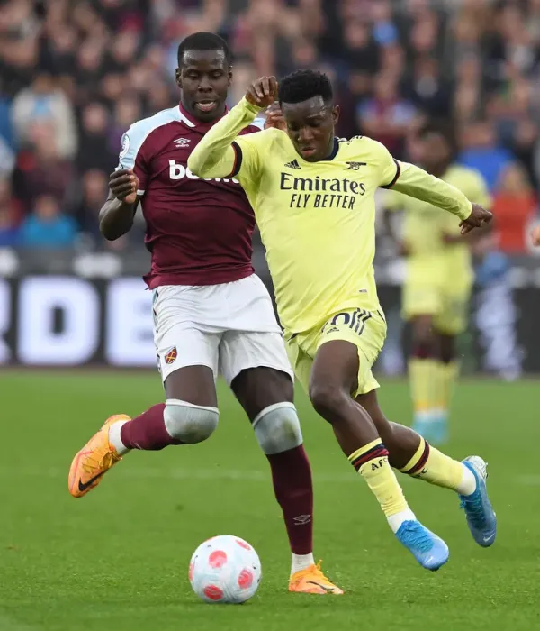 Framed Print : Arsenal's Eddie Nketiah Faces Off Against West Ham's Kurt Zouma in Premier League Clash