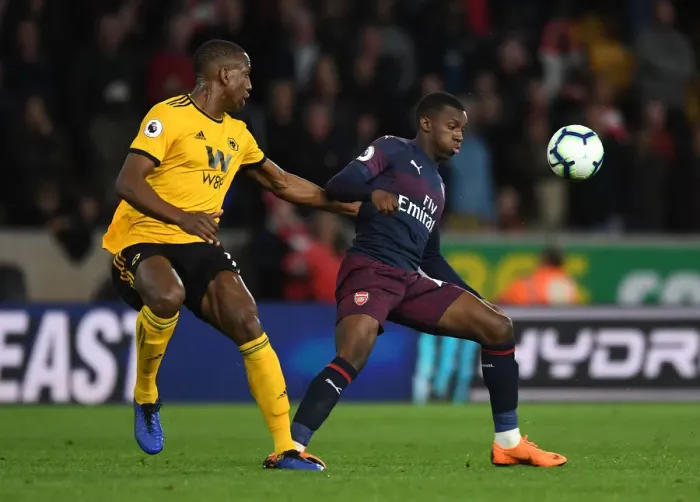 Framed Print : Arsenal's Eddie Nketiah Faces Off Against Wolves Willy Boly in Intense Premier League Clash Framed Print : Arsenal's Eddie Nketiah Faces Off Against Wolves Willy Boly in Intense Premier League Clash