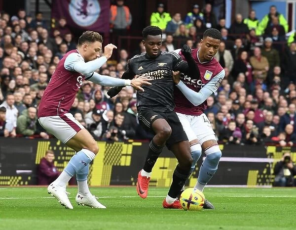 Arsenal's Eddie Nketiah Fends Off Aston Villa Defenders During Premier League Clash