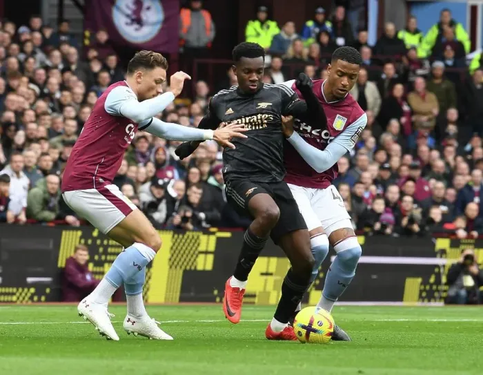 Framed Print : Arsenal's Eddie Nketiah Fends Off Aston Villa Defenders During Premier League Clash Framed Print : Arsenal's Eddie Nketiah Fends Off Aston Villa Defenders During Premier League Clash