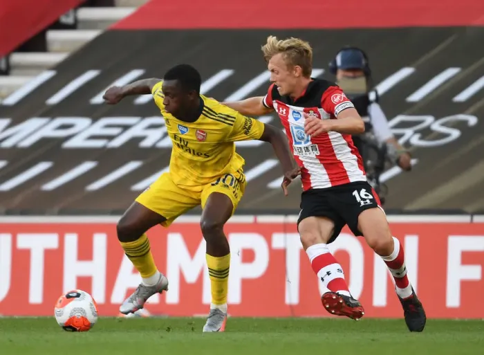 Framed Print : Arsenal's Eddie Nketiah Fends Off Southampton's James Ward-Prowse in Intense Premier League Clash (Southampton v Arsenal 2019-20) Framed Print : Arsenal's Eddie Nketiah Fends Off Southampton's James Ward-Prowse in Intense Premier League Clash (Southampton v Arsenal 2019-20)