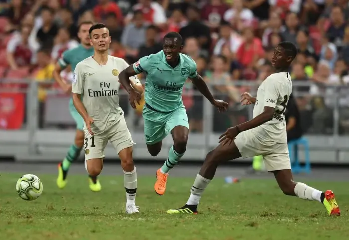 Framed Print : Arsenal's Eddie Nketiah Goes Head-to-Head with Moussa Sissako and Alec Georgen of Paris Saint-Germain in Intense 2018 Pre-Season Clash Framed Print : Arsenal's Eddie Nketiah Goes Head-to-Head with Moussa Sissako and Alec Georgen of Paris Saint-Germain in Intense 2018 Pre-Season Clash