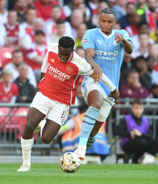 Arsenal's Eddie Nketiah Outmaneuvers Manchester City's Manuel Akanji in FA Community Shield Clash, 2023-24