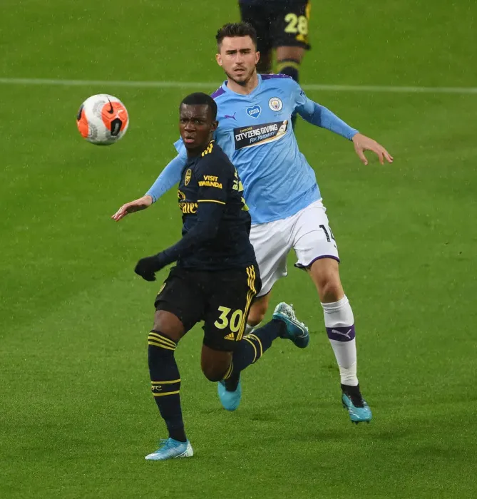 Framed Print : Arsenal's Eddie Nketiah Outmaneuvers Manchester City's Aymeric Laporte in Premier League Clash (Manchester City vs Arsenal 2019-20)